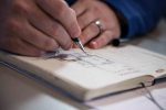 hand sketching in notebook
